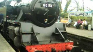 steam engine pulling in to the station