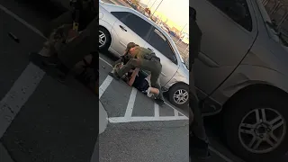 man puts police officer in headlock!