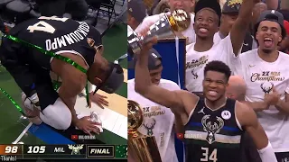 Milwaukee Bucks celebrate with the NBA Finals trophy after game 6 vs Suns