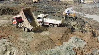 Big Best Equipment Machine Dozer Push Stone mud and Trucks Spreading Stone Rock Mud to Delete Lake