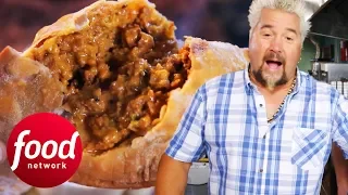 Guy Fieri Can't Get Enough Of This Spicy Sausage Meat Pie! | Diners, Drive-Ins & Dives