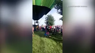 Hot air balloon crashes into crowd of people during festival