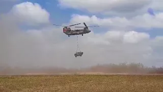 Chinook helicopter transporting vehicles for use during Exercise Wallaby