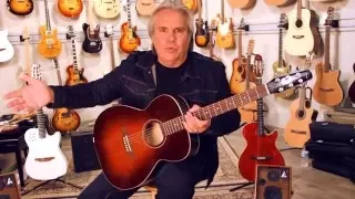 Doyle Dykes tries out a Seagull guitar at Godin Studios