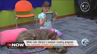 Kids read to dogs