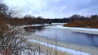4K UHD Winter scenery on a snowy river.  1 hour relaxation video with background music