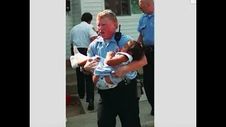 After 19 years, police officer and toddler he saved reunite