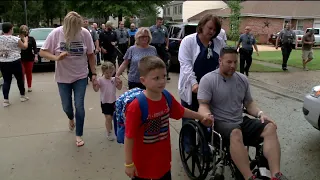 As local officer battles cancer, fellow police gather to escort 5-year-old to first day of school