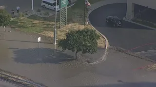 Crews respond to major water main break outside Dallas hotel