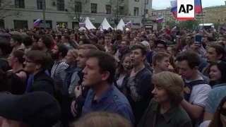 Police beat, arrest opposition protesters in Moscow