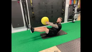 Medicine Ball Boat Pose