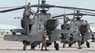 US Airmen Inspect Air Delivered Super Powerful AH-64 Attack Helicopters