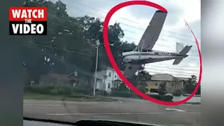 Plane crash lands on busy street, narrowly missing oncoming vehicles