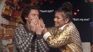 tom holland & zendaya can't keep their hands off each other