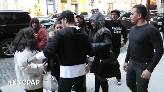 Zayn Malik stops for fans before heading into  Gigi hadid's apartment