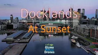 Beautiful Autumn Sunset across Docklands, Bolte Bridge and Melbourne CBD by Drone