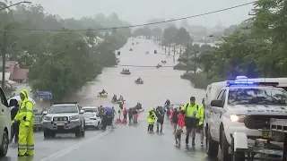 People flee as floods submerge Australian towns