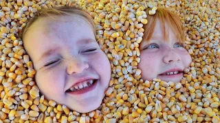 BURiED in CORN!!  Niko & Adley slide down Pumpkin Castle a family Halloween tradition and face paint