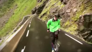 To ride a bike backwards at 80 km/h!