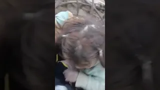 WARNING: GRAPHIC CONTENT - Children are pulled alive from under earthquake rubble