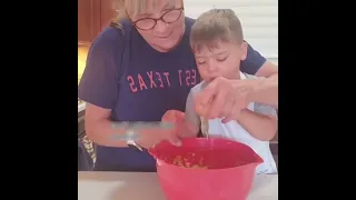 kid eating everything while cooking
