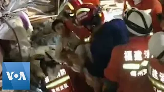 Boy and Mother Rescued 52 Hours After Building Collapses in China