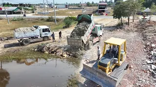 First Start opening new Project, Bulldozer KOMATSU D31PX Push Soil & Stone Into Water, Dump Truck