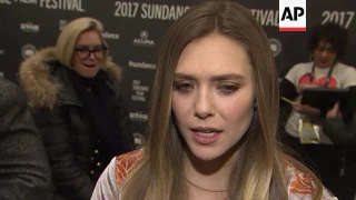 At premiere of 'Wind River,' Jeremy Renner and Elizabeth Olsen talk about working on a film together