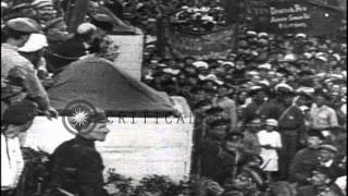 Vladimir Lenin addresses a large crowd at the Red Square and sits in his office a...HD Stock Footage