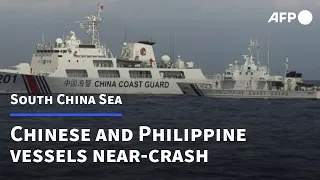 Chinese, Philippine vessels near-crash | AFP