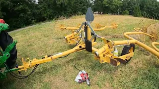 5075E raking hay with Vermeer WR20