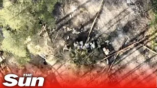 Russian troops scramble as Ukrainian drone drops bomb on trench