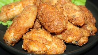 Crispy chicken wings in golden coating