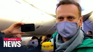 Alexey Navalny detained on return to Moscow five months after being poisoned