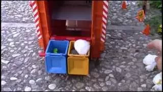 Bruder Garbage Truck Rear Loader picking up trash - video for kids with fun world percussion music