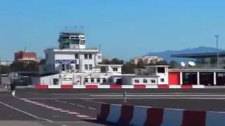 Gibraltar Airport Runway with road crossing Airbus take off, landing