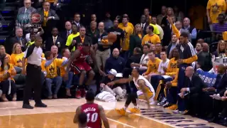 LeBron James falls into Shaq's lap!