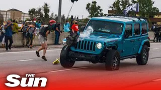 Jeep mows into Black Lives Matter march before protester fires gun, injuring two people in Colorado