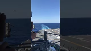 Jet landing on Aircraft Carrier