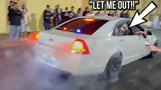 COP CAR DOING BURNOUTS WITH SOMEONE IN THE BACK!!