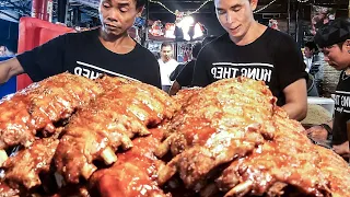 Bangkok Street Food. Extra Juicy Ribs, Meat, Seafood and more. Ratchada Train Market, Thailand