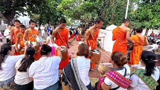 The monks walked along the street of Luang Prabang for Alms offering