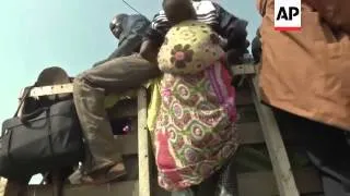 Thousands of Muslims climbed aboard trucks guarded by heavily armed Chadian forces to flee from the