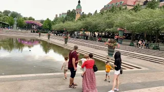 Stockholm Walks: Kungsträdgården. Central park and people on a summer evening in July 2021.