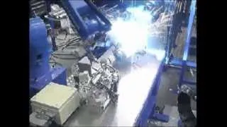 Motoman robots welding and handling automotive parts