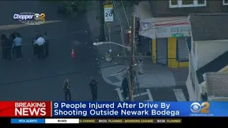 9 people injured after drive-by shooting outside Newark bodega