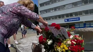 Dozens of supporters of Slovak Prime Minister Robert Fico gather outside hospital
