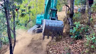 Masterful Excavator Operator Crafts Mountain Road Unexpectedly | Road Building | The Quirky Network