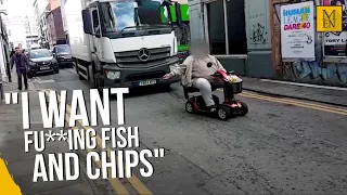 "I just want a fu**ing fish and chips" Angry mobility scooter driver blocks road