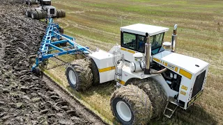 DMI 21 Bottom Plow and Big Bud Tractors